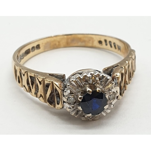 489 - 9ct gold ring with centre sapphire and diamond surround. Size P. Weight 3.15 grams