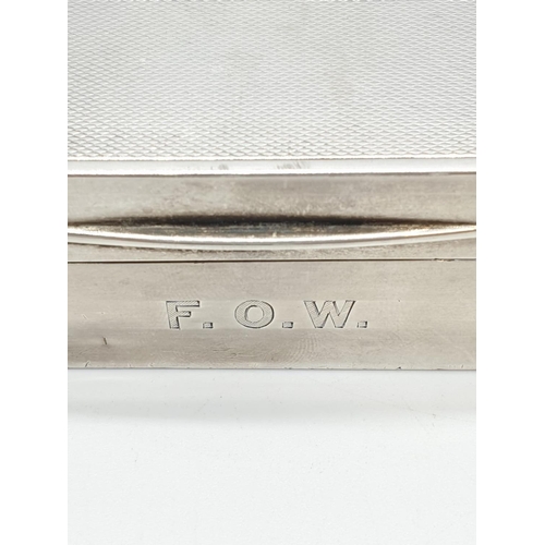 60 - Silver cigarette box with wood interior. Hall marked London 1915. 338 grams. 15x9cms.