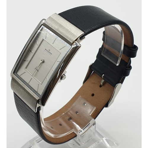 639 - A 'Skagen' men's wrist watch. Ultra slim, stainless steel case with black leather strap.