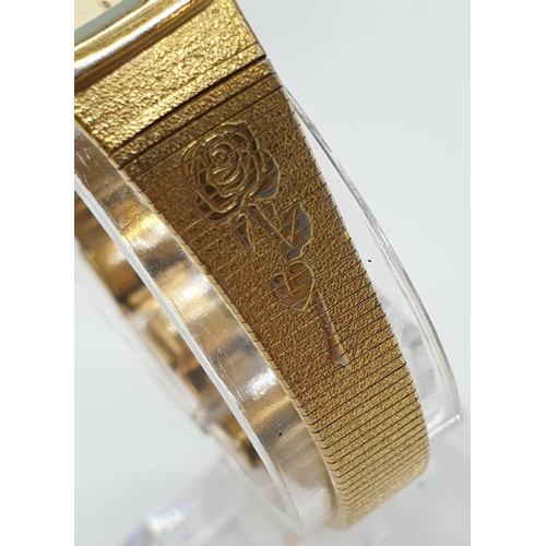 686 - A ladies gold colour Accurist quartz watch with 2 x rose motif on strap.