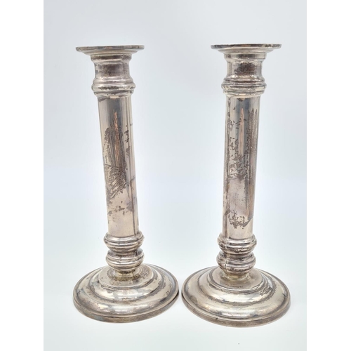 472 - A Pair of Column Candle Stick. 925 Sliver. Weight:1.25kg. 20cm Height. 9cm Diameter at Base.