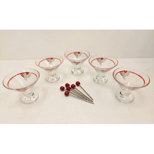 128 - Vintage Art Deco styled cocktail shaker, 5 glasses and glass cherries. Fair condition for age.