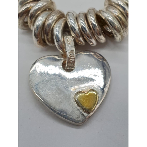 143 - Links of London style silver bracelet with heart charm. 77.5 grams. 17cm in length.