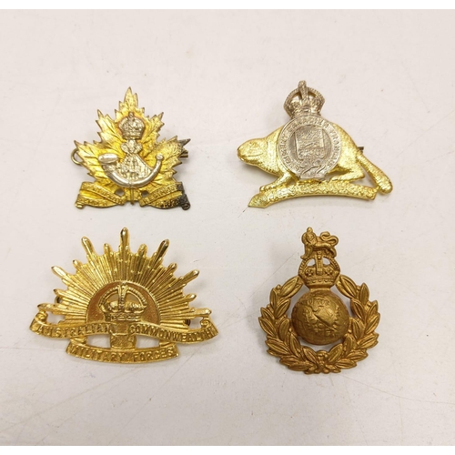 208 - 27 multi-national military badges, including the Highland regiment @Cuidich n Rich' and the Royal Ca... 