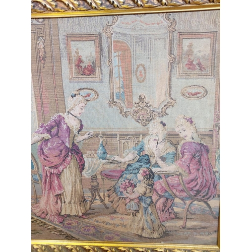 264 - A French Rococo parlour scene tapestry in a gold baroque-style frame. 114 x 62cm.