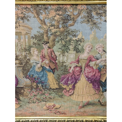 269 - A French Rococo tapestry depicting gaiety in the garden, in a gold baroque style frame. 100 x 54cm.