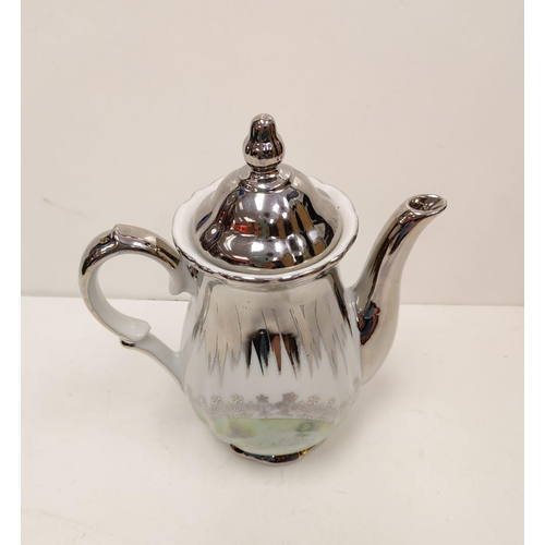 271 - Part of a 'Bernadotte' gold tea set and silver Bavaria teapot.