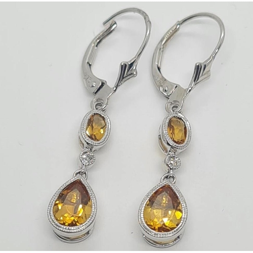 283 - 14ct white gold Diamond & Citrine drop earrings, weight 2.5g and 4cm drop