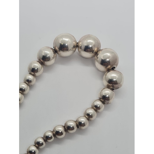 312 - Sterling Silver Graduated Ball Bracelet, weight 21g and 20cm long approx