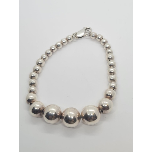 312 - Sterling Silver Graduated Ball Bracelet, weight 21g and 20cm long approx