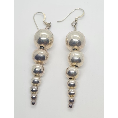 314 - Sterling Silver Graduated Ball Drop Earrings, weight 12g and 4.5cm drop approx