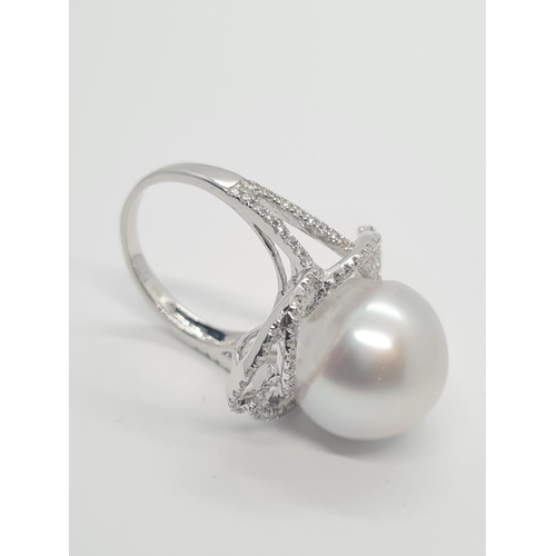 401 - 18ct white diamond ring with large south sea pearl centre (14.82mm) and 1.08ct diamond, weight 9.58g... 