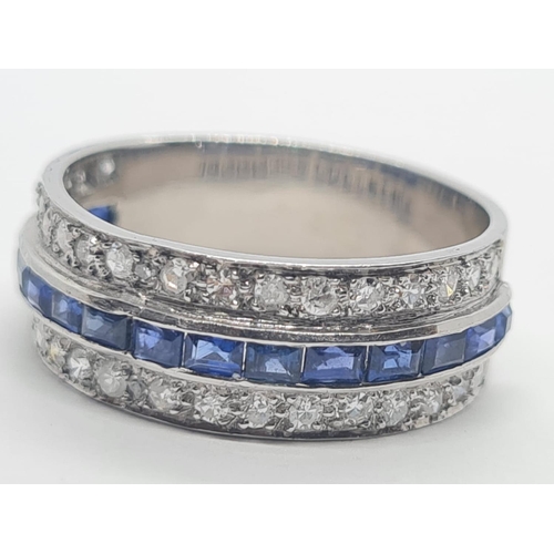 430 - Tested 18ct gold diamond and sapphire half eternity ring, weight 7.1g and size R