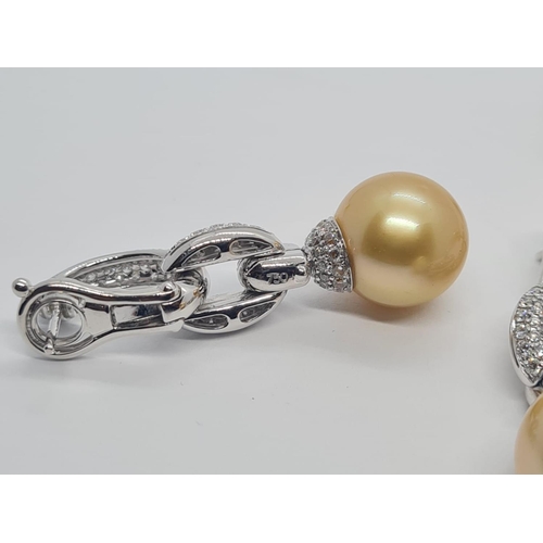 445 - Pair of 18ct white gold diamond earrings with natural golden pearls, weight 15.8g and drop 4cm long ... 