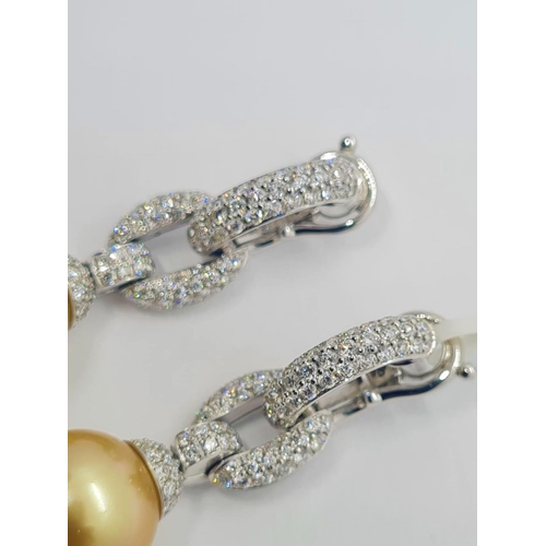 445 - Pair of 18ct white gold diamond earrings with natural golden pearls, weight 15.8g and drop 4cm long ... 