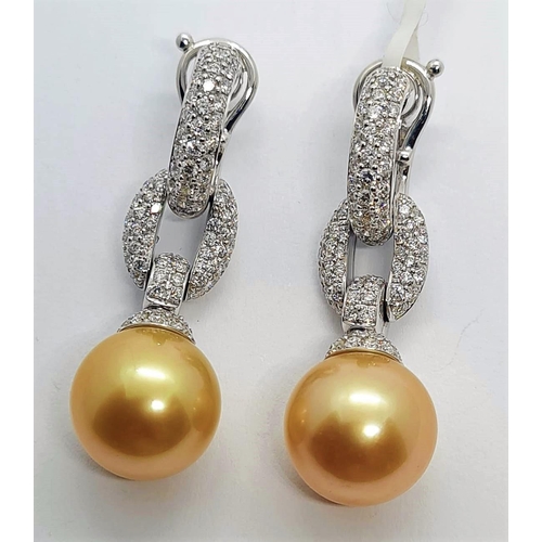 445 - Pair of 18ct white gold diamond earrings with natural golden pearls, weight 15.8g and drop 4cm long ... 