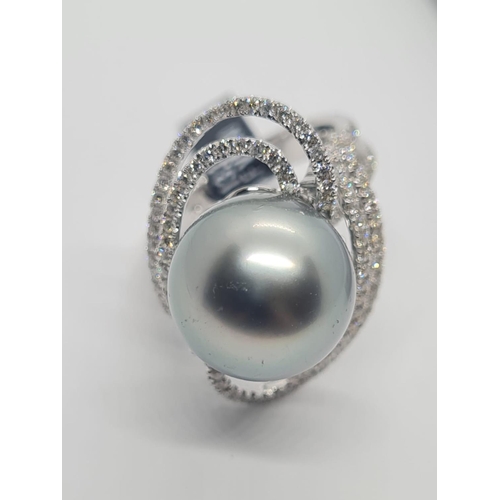 488 - 18ct white gold diamond ring with Tahitian pearl centre, weight 10.07g and size N