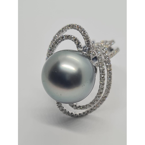 488 - 18ct white gold diamond ring with Tahitian pearl centre, weight 10.07g and size N