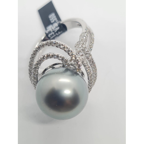 488 - 18ct white gold diamond ring with Tahitian pearl centre, weight 10.07g and size N