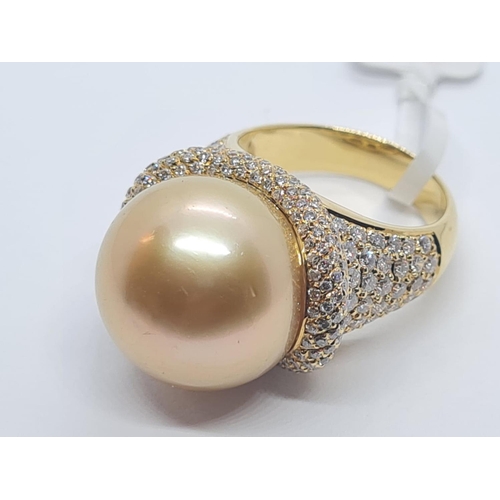 505 - 18ct yellow gold with a 16mm natural golden pearl and diamond encrusted shoulder and flanks, weight ... 