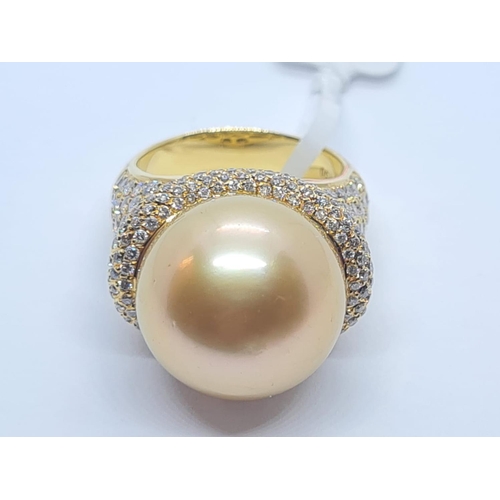 505 - 18ct yellow gold with a 16mm natural golden pearl and diamond encrusted shoulder and flanks, weight ... 