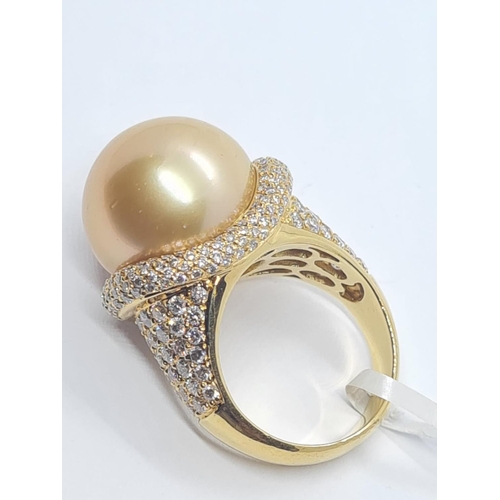 505 - 18ct yellow gold with a 16mm natural golden pearl and diamond encrusted shoulder and flanks, weight ... 