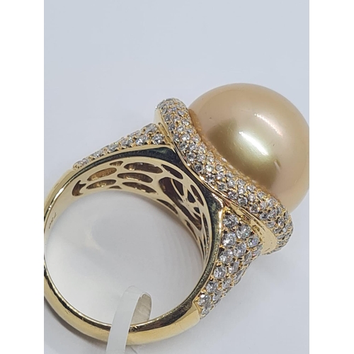 505 - 18ct yellow gold with a 16mm natural golden pearl and diamond encrusted shoulder and flanks, weight ... 