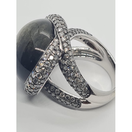 526 - 18ct white gold diamond modern designed ring with large stone centre, weight 17.6g and size