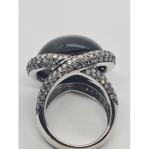 526 - 18ct white gold diamond modern designed ring with large stone centre, weight 17.6g and size