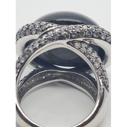 526 - 18ct white gold diamond modern designed ring with large stone centre, weight 17.6g and size