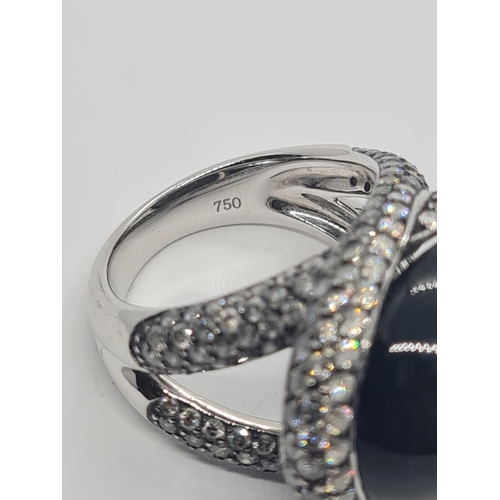 526 - 18ct white gold diamond modern designed ring with large stone centre, weight 17.6g and size