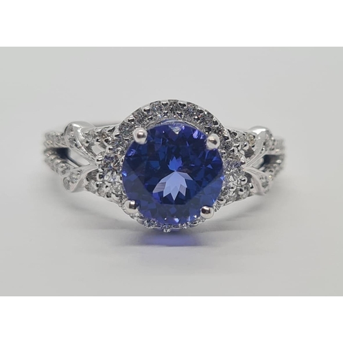 533 - 18CT WHITE GOLD RING WITH 1.8CT TANZANITE AND DIAMOND ENCRUSTED, WEIGHT 4.9G AND SIZE N