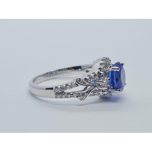 533 - 18CT WHITE GOLD RING WITH 1.8CT TANZANITE AND DIAMOND ENCRUSTED, WEIGHT 4.9G AND SIZE N