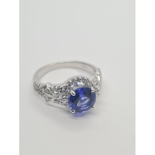 533 - 18CT WHITE GOLD RING WITH 1.8CT TANZANITE AND DIAMOND ENCRUSTED, WEIGHT 4.9G AND SIZE N