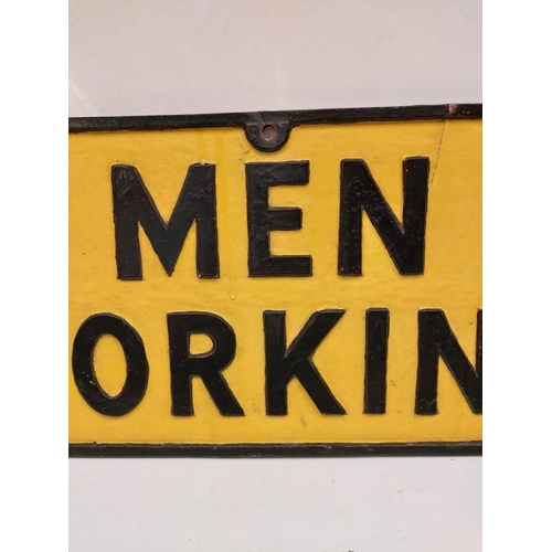 563 - A vintage 'Men Working' metallic sign. Black print on yellow.