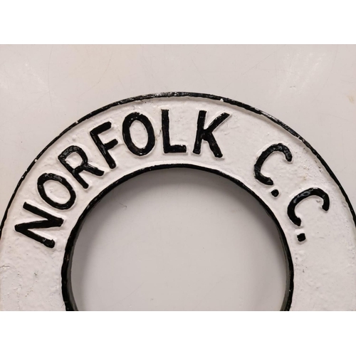 576 - A cast iron circular Norfolk C.C. sign. 32cm diameter.