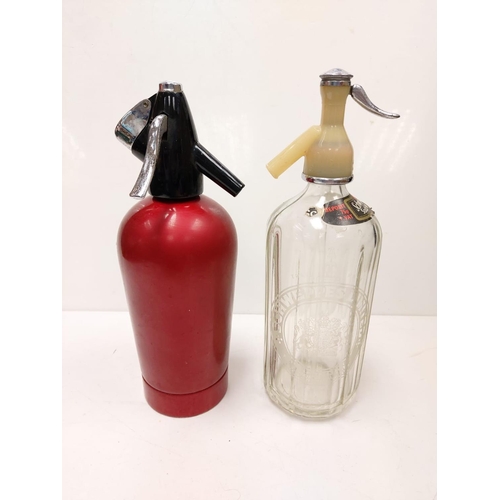 597 - A pair of vintage soda-water dispensers. 1 Schweppes and 1 Sparklets. 30cm in height.