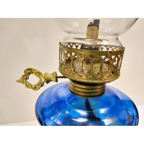 609 - Vintage, blue glass oil lamp, with gold decor base and middle section. 34cm height.