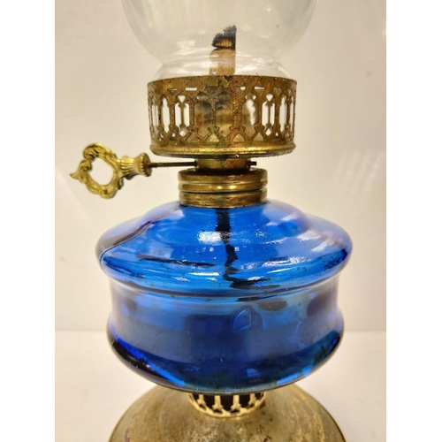 609 - Vintage, blue glass oil lamp, with gold decor base and middle section. 34cm height.