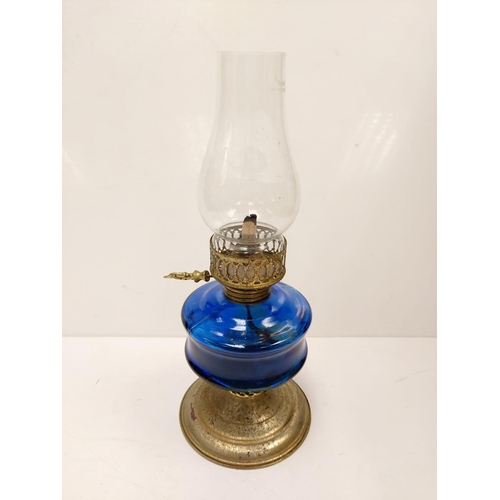 609 - Vintage, blue glass oil lamp, with gold decor base and middle section. 34cm height.