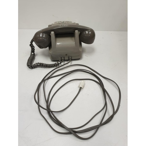 614 - Grey retro-phone with coil cord handset and turn dial. 11.5 x 14cm (24.5cm handset).