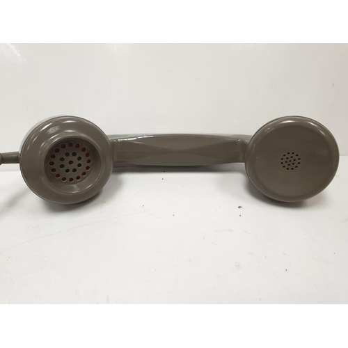 614 - Grey retro-phone with coil cord handset and turn dial. 11.5 x 14cm (24.5cm handset).