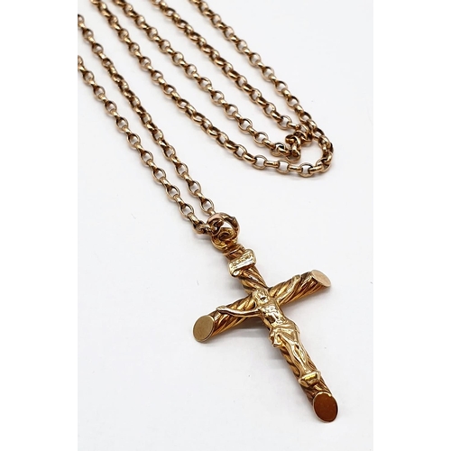 124 - 9ct gold cross pendant on a 52cm long 9ct gold belcher  chain, weight 4g and cross size 3x2cm approx