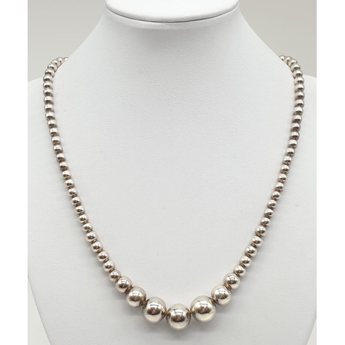 313 - Sterling Silver Graduated Ball Necklace, weight 38g and expandable chain (longest at 52cm approx)