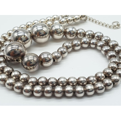 313 - Sterling Silver Graduated Ball Necklace, weight 38g and expandable chain (longest at 52cm approx)