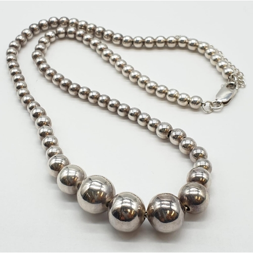 313 - Sterling Silver Graduated Ball Necklace, weight 38g and expandable chain (longest at 52cm approx)