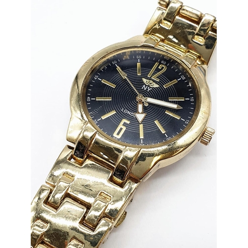 465 - Gents N.Y. wristwatch. Black face, gold tone model. Full working order.