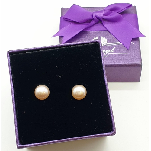 473 - Silver and pearl earrings. Having freshwater pearl studs set in silver. Gift Boxed.h