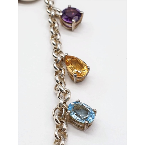 480 - Silver bracelet with gem stones mounted in charm bracelet fashion. Stones to include amethyst, garne... 