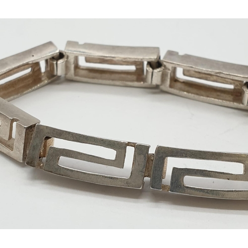 605 - A silver bracelet in byzantine design. 18.1 grams. 18cm length.